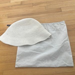 Brand new Cos straw bucket hat. Never worn, comes with dust bag.